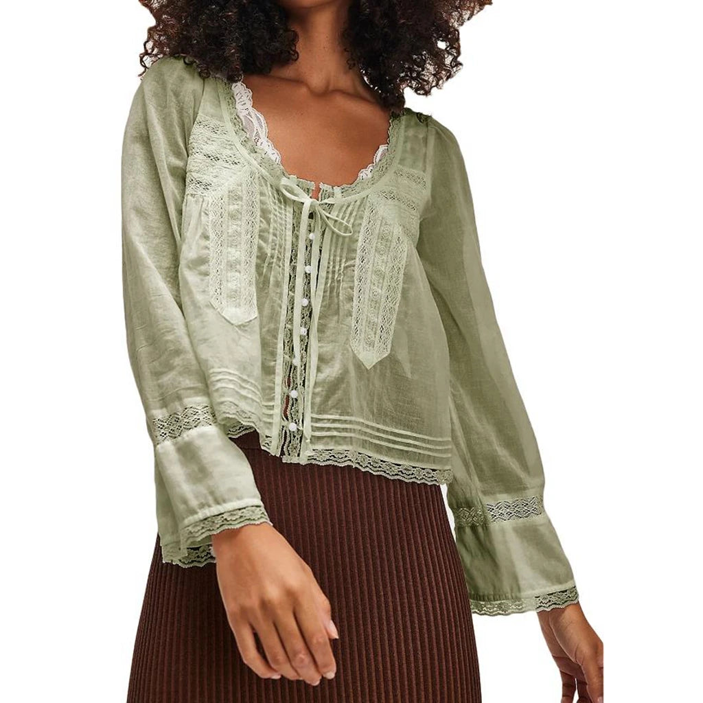 Blusa transparente con cordones