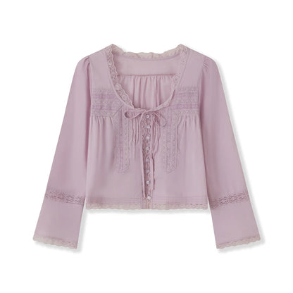 Blusa transparente con cordones